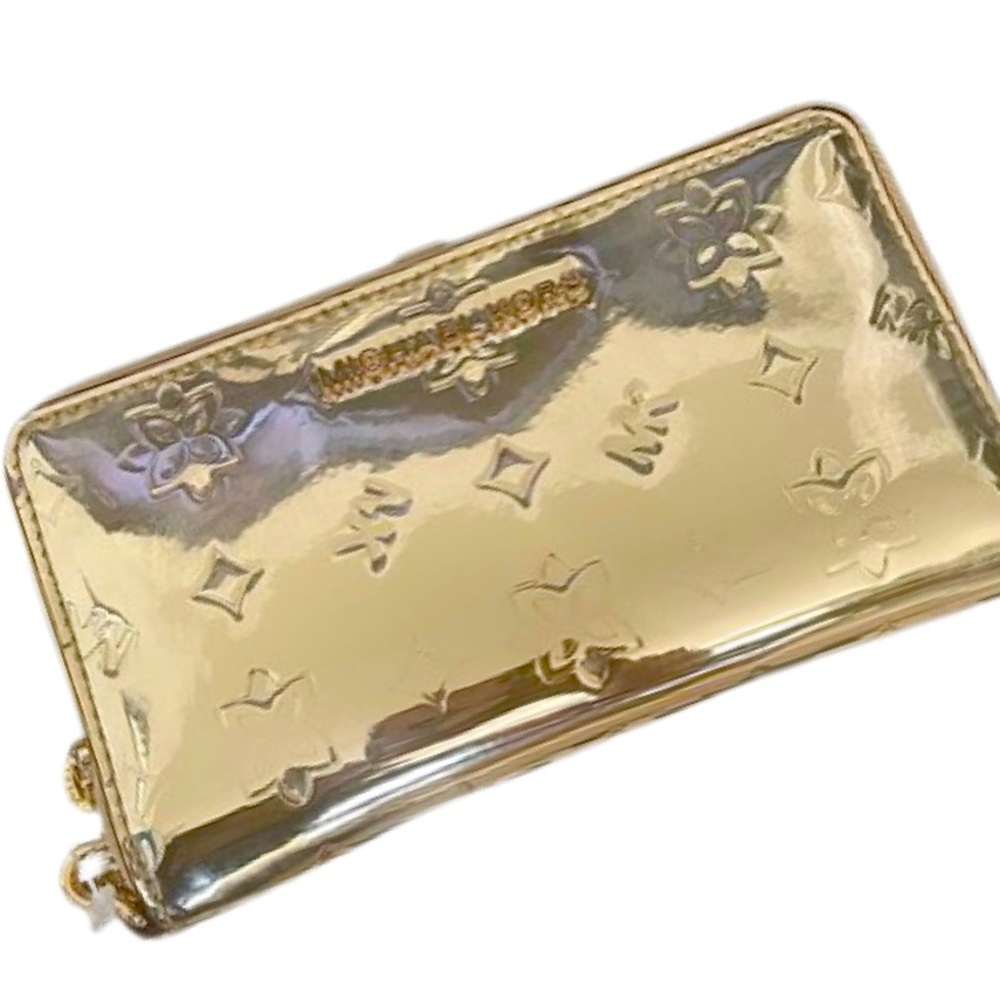 Chrome gold Michael Kors wallet with tons of slots for credit cards